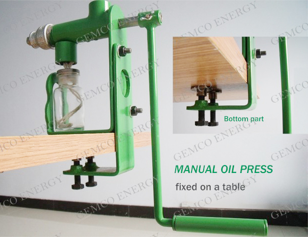 manunal oil press fixed on a table